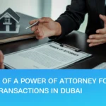 Power of attorney for real estate transactions in Dubai, with a property consultant and client signing a POA document beside a model house